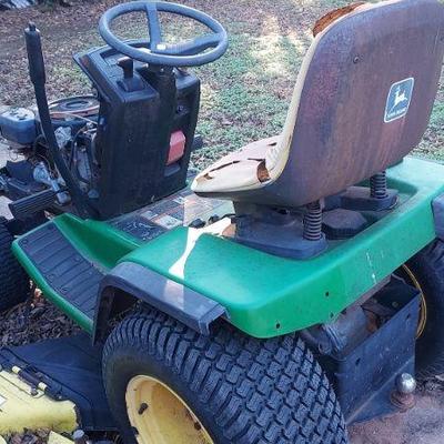 2 riding lawm mowers as found