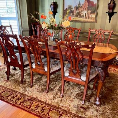 Unusual Table and 8 chairs carved not only on the front but also on the back of the chairs so that you can enjoy them from across the...
