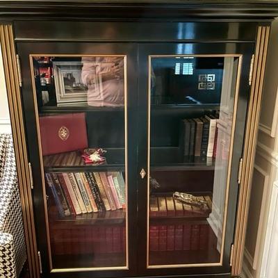 Exceptional bookcase ebony with gilt and glass.  