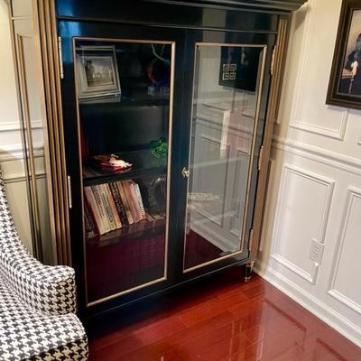 Exceptional bookcase ebony with gilt and glass.  