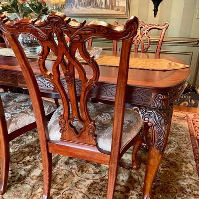 Unusual Table and 8 chairs carved not only on the front but also on the back of the chairs so that you can enjoy them from across the...
