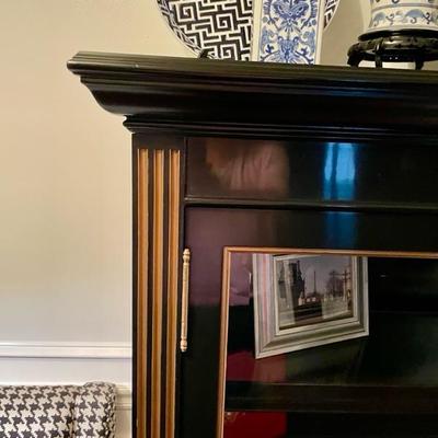 Exceptional bookcase ebony with gilt and glass.  