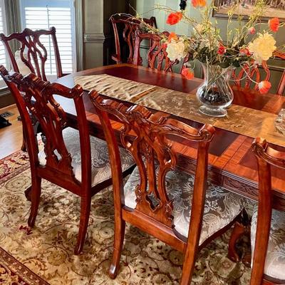 Unusual Table and 8 chairs carved not only on the front but also on the back of the chairs so that you can enjoy them from across the...