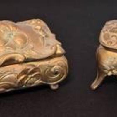 Pair of Vintage Art Nouveau Jewelry Caskets.

Both have some wear to the inner lining.

The largest measures 4” x 3” and 2.5” high.
