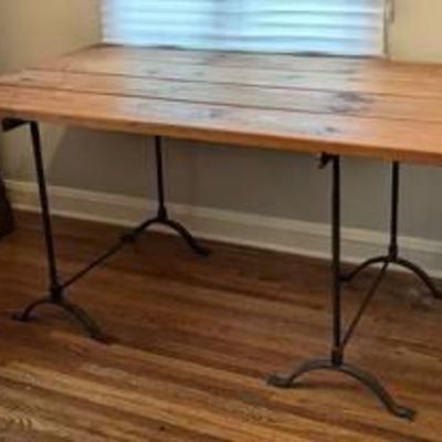 Pine and Iron Work Desk/Table.

There are some surface scratches that can be seen in the photos.

Measures 60” x 33” and 30” high. 