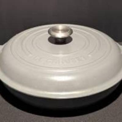 Le Creuset Grey Enamel Covered Cast Iron Pan. Appears to be in great condition. 

Measures 13” in diameter.