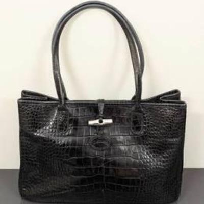 Longchamp Crocodile Print Black Leather Handbag.

There is some wear on the bottom that can be seen in the photos.

Measures 14” wide and...