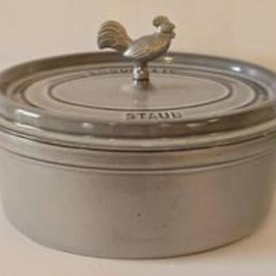 Lacocotte Staub Covered Casserole

Two handled oval gray enameled cast iron casserole with rooster handled lid.

In like-new condition -...