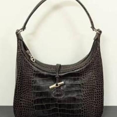 Longchamp Roseau Black Leather Handbag.

Appears to be in very good condition.

Measures 11.5” wide and 8” high.