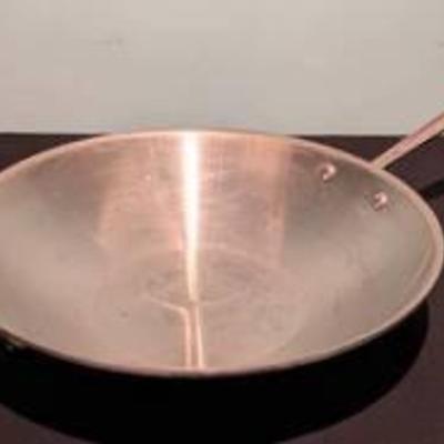 All Clad LTD Stainless Steel Wok.

Appears to be in overall good condition. Measures 3” high and 14” in diameter.