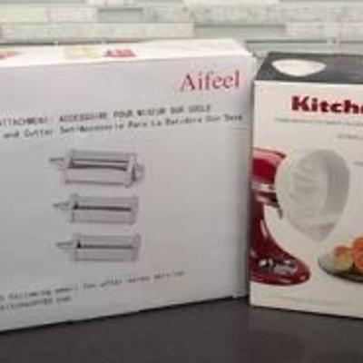 KitchenAid Standing Mixer Pasta and Juicer Attachments. Both appear to be new in the box.