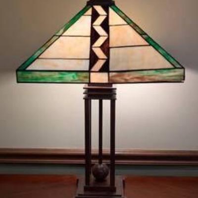 Mission Style Stained Glass Table Lamp.

The weld is loose on one corner and can be seen in the photos.

Measures 28” high and the lamp’s...