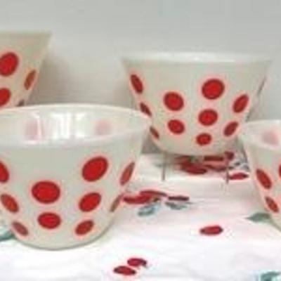 Vintage Fire King Mixing Nesting Mixing Bowl Set white with red dots and vintage kitchen towel.

The mixing bowls measure 9 1/2", 8...