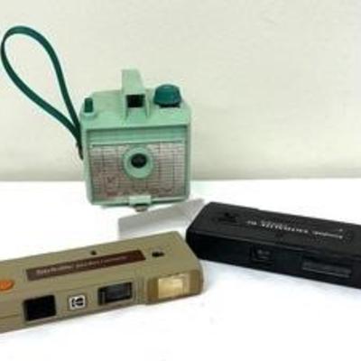 Three Vintage Cameras including a Kodak Stylite Pocket Camera, Kodak Ektralite 10 and Savoy Cameras 

These make for awesome retro decor! 