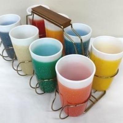 Vintage Glamalite set of 8 milk glass tumblers with caddy. All in good used vintage condition.

No chips or cracks, some slight wear...