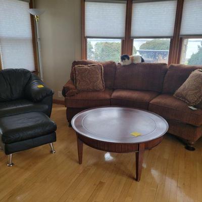 Nice chair w/ ottoman 
Curved Couch and really nice coffee table