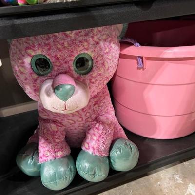 Squish Mellow and a pink kids storage barrel.