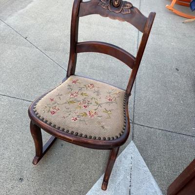 Embroidered seat on vintage rocker.