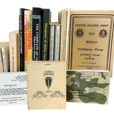 TEWA811 Vintage Military Books And More	Assortment of Military instruction books, firearm manuals, and military history books. Some of...