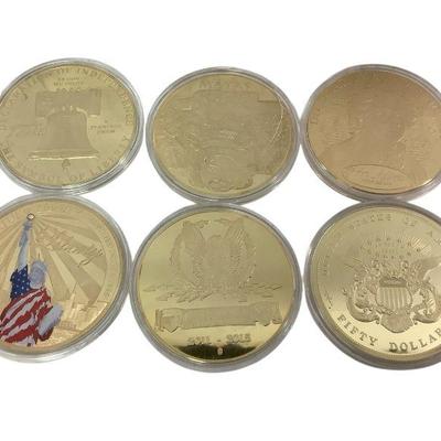 TN19 Group Of 6 Large Golden Tokens	American Mint tokens, still sealed in cases.
