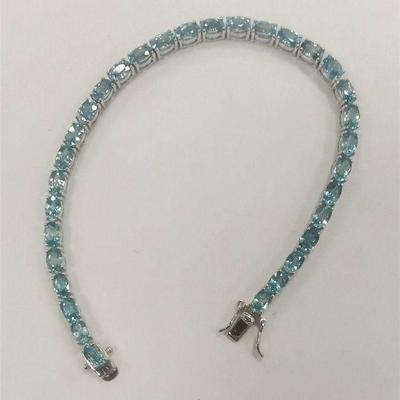 THAI STERLING BRACELET WITH BLUE TOPAZ COLORED STONES