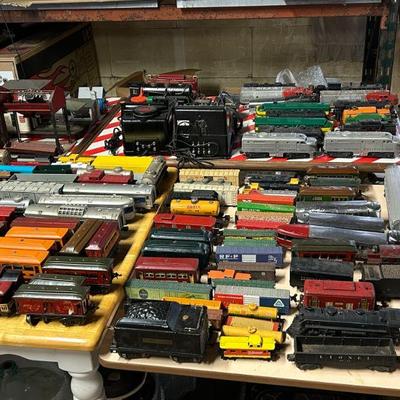 A huge Lionel Train collection that dates back to the 1920's featuring engines, locomotives, boxcars, tracks, power supplies,...