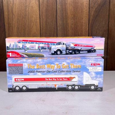 (2pc) Exxon Oil Trucks | Two Exxon die-cast gas trucks, including a Tanker Truck by Fruehauf. - h. 5.75 x l. 16 in (largest box)

