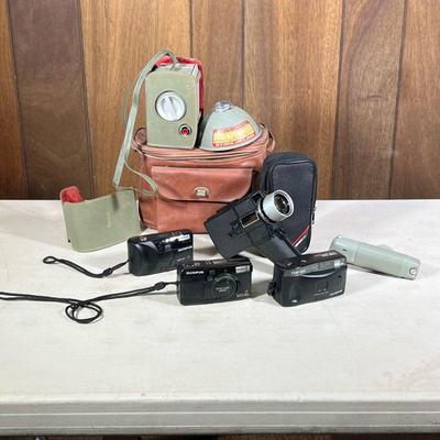 (5pc) Film Cameras | Including a Sears reflex super eight video camera, three Olympus 35 mm film cameras, and a Ansco medium format film...