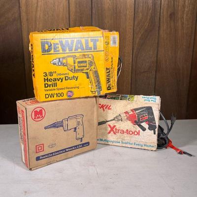 (3pc) Power Drills | Three electric plug in drills including a Dewalt, a Skil xtra-tool, and a Makita drill.

