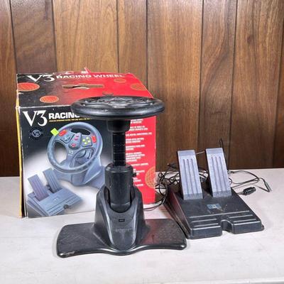 N64 Racing Wheel | V3 Racing Wheel: analog steering wheel for use with the Nintendo 64 game system, comprising a wheel and dual pedals. -...