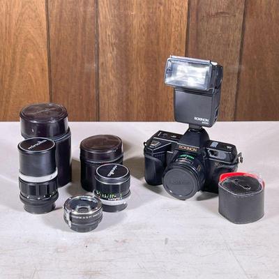 Rokinon 35mm SLR Camera | 35mm film camera by Rokinon with flash attachment and original box; plus two Minolta lenses in cases and a...