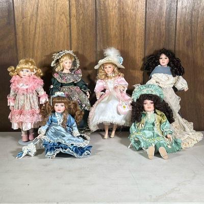 (6pc) Fancy Porcelain Dolls | Including a Caldor Early Blossom Collection porcelain doll, a doll in a fancy lace dress, a porcelain doll...
