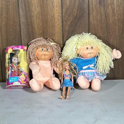(4pc) Cabbage Patch & Barbie Dolls | Including two Cabbage Patch dolls, a Barbie doll, and a Disney keepsake porcelain doll in...