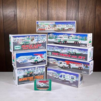 (9pc) Hess Trucks | Holiday Hess toy trucks, including a Monster Truck with Motorcycle, Rescue Truck, Toy Truck and Jet, Race Car and...