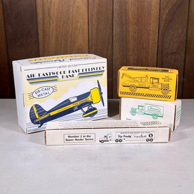 (4pc) Eastwood Company Trucks | Including a die-cast metal Air Eastwood airplane, a Museum of Drag Racing hauler, a 1931 Wrecker Bank,...