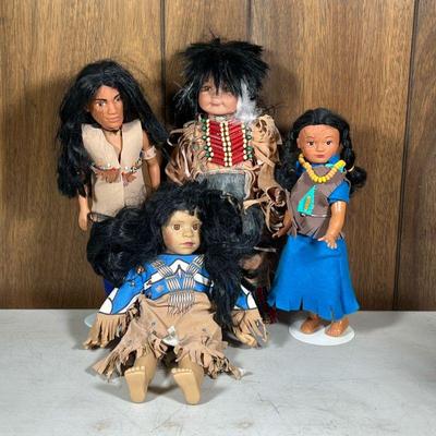 (4pc) Native American Dolls | Including a porcelain head Cathay collection doll, and three plastic dolls, two on stand. - h. 16.5 in...