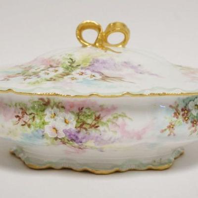 1011	LIMOGES HAND PAINTED COVERED DISH, FLORAL, OVAL W/GILD RIBBON & BOW HANDLES, ARTIST SIGED & DATED 1898, APPROXIMATELY 11 IN...
