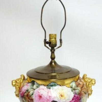 1031	PORCELAIN HAND PAINTED LAMP W/GILT LION HEADS & ROSES ALL OVER, PAW FEET, LAMP HAS HAIRLINE, APPROXIMATELY 30 1/2 IN HIGH
