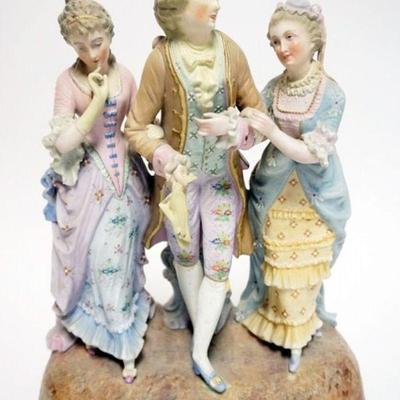 1061	LARGE BISQUE STATUE OF GENTLEMAN COURTING 2 WOMEN, APPROXIMATELY 5 IN X 11 IN X 13 IN H
