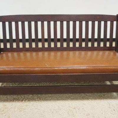 1188	MISSION STYLE OAK SETTEE WITH SLIP CUSHON VINYL COVERED SEAT, TEAR TO VINYL AND REPAIR ON REAR STREATCHER, APPROXIMATELY 77 IN X 27...