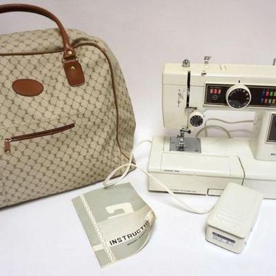 1115	DRESS MAKER SEWING MACHINE, MODEL 61O2FA WITH CARRYING CASE
