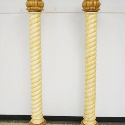1189	PAIR OF ORNATE COMPOSITE FAUX PAINT DECORATED SPIRAL CENTERED COLUMNS ON ROUND MARBLE BASES, EACH APPROXIMATELY 86 IN H

