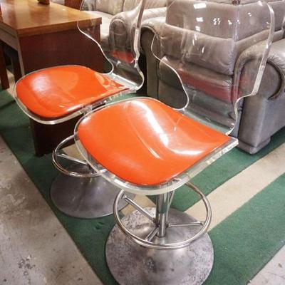 1180	MID CENTURY MODERN PAIR OF LUCITE CHAIRS ON ALUMINUM BASES, APPROXIMATEY 38 IN H. PITTING ON THE CHAIR BASES
