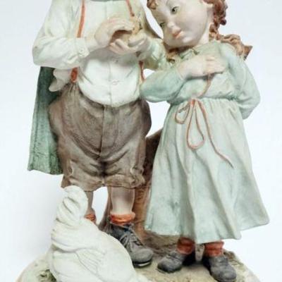 1062	CAMPIDIMONTE PORCELAIN STATUE OF YOUNG BOY AND GIRL FEEDING CHICKENS, APPROXIMATELY 11 IN H
