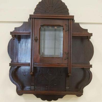 1153	VICTORIAN WALNUT HANGING CURIO CABINET WITH BEVELED GLASS CENTER DOOR, APPROXIMATELY 23 INX 8 IN X 28 IN H
