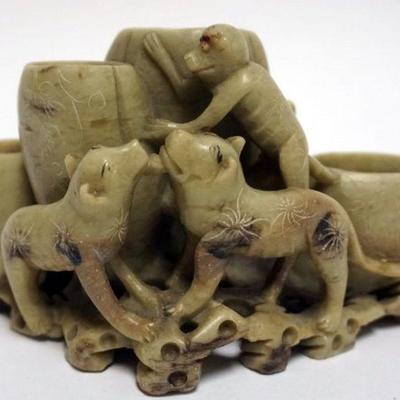 1047	CARVED SOAP STONE VASE WITH IMAGES OF MONKEY CLIMBING TO TOP AND 2 DOGS AT BASE, APPROXIMATELY 7 IN X 3 3/4 IN HIGH
