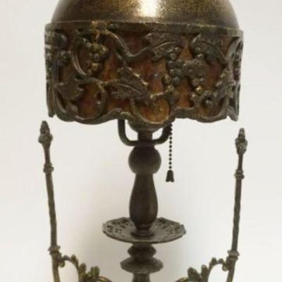 1043	BACCHUS METAL TABLE LAMP WITH ORNATE METAL MICA LINED SHADE WITH IMAGES OF BACCHUS MASK AND GRAPE VINE CLUSTERS, APPROXIMATELY 21...