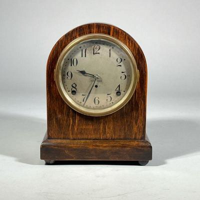 SETH THOMAS DOMED SHELF CLOCK | Case marked "Made in USA" and numbered 89, with a lead pendulum, having a silvered dial with...