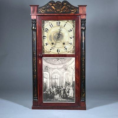 ATKINS & DOWNS WALL CLOCK | With black and gilt painted crest and half columns. - h. 34 x w. 17.5 x d. 5 in

