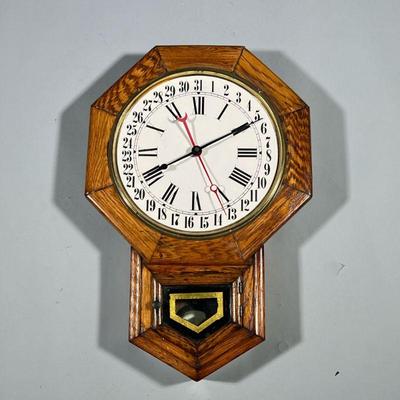OCTAGONAL WALL CLOCK | Wall clock with octagonal face, gilt & glass door, and pendulum. - h. 24 x w. 16 x d. 4 in

